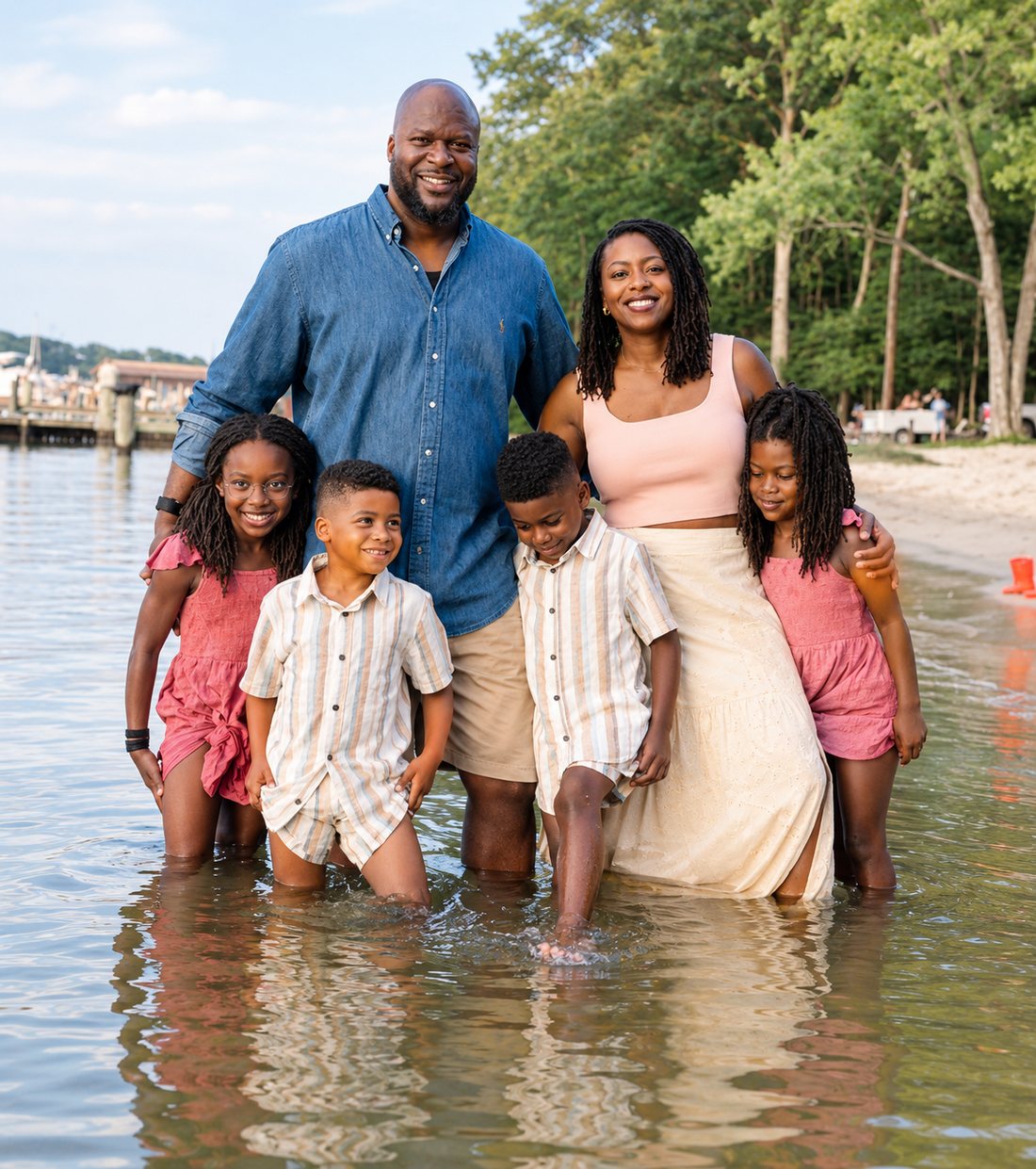 Colle Jemibewon with her husband and their four children, wading at the water’s edge